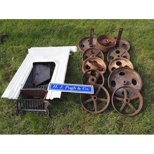 876 - Quantity of cast iron wheels and fire surround