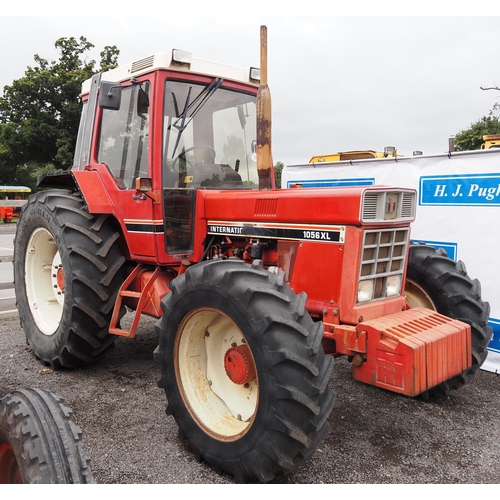 1705 - International 1056 XL 4WD tractor. Runs and drives well, showing 8247 hours, clean original tractor,... 