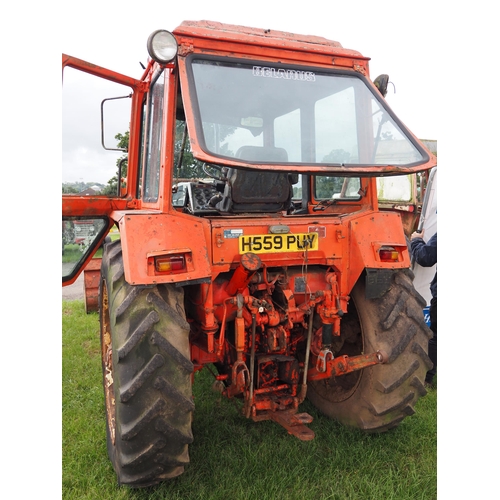 1633 - Belarus 572 4 cylinder tractor, 4 WD with loader and bucket. Runs and drives. Reg. H559 PUY