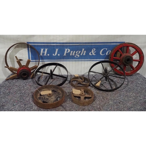 193 - Cast iron wheels and wooden wheels