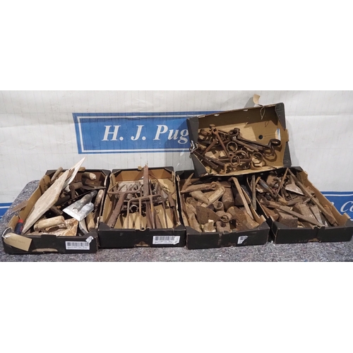 204 - Pick axe heads, hammer parts, chisels and garden tools