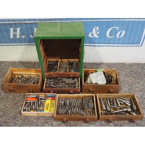 426 - Wooden workshop cabinet and contents of drill bits, milling cutters, etc.