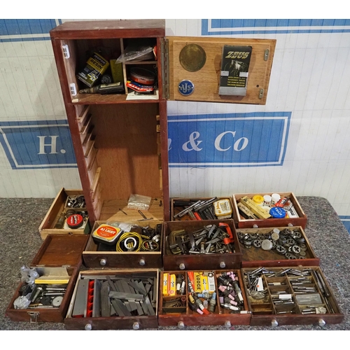 452 - Wooden workshop cabinet and contents of clamps, spark plugs, steel offcuts, etc.