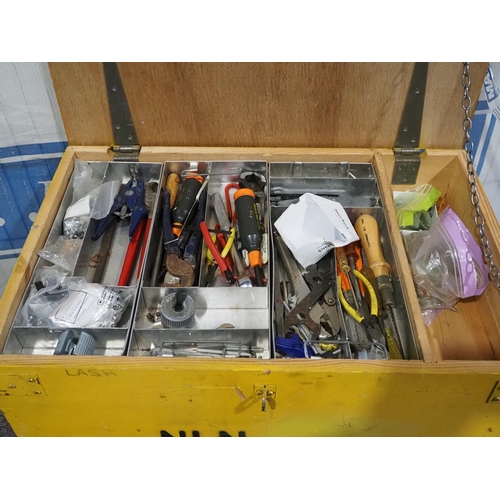 571 - Wooden chest on trolley wheels with contents to include hand tools