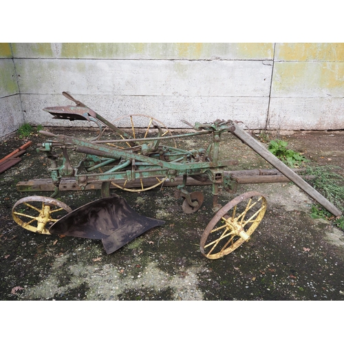 65 - John Deere Sulky ride on plough with moving pole and 2 extra poles