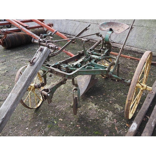 65 - John Deere Sulky ride on plough with moving pole and 2 extra poles