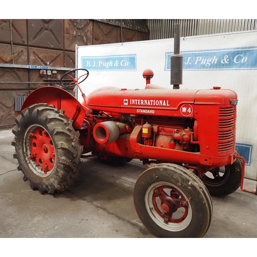 93 - International W-4 Standard tractor. Engine is free. Fitted with good tyres, pto and drawbar