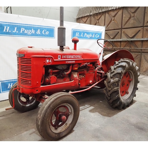 93 - International W-4 Standard tractor. Engine is free. Fitted with good tyres, pto and drawbar