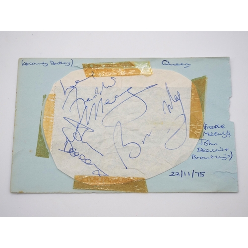 380 - Freddie Mercury's, John Deacon's and Brian May's autograph on card dated 22/11/1975