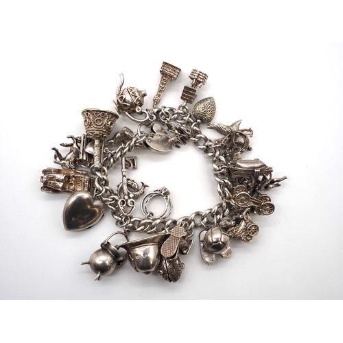 Silver charm bracelet. Total weight approx. 109.5g