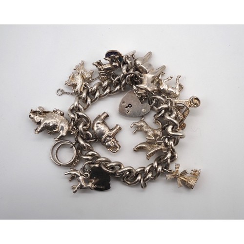 342 - Silver charm bracelet. Total weight approx. 68g