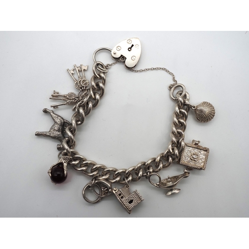 350 - Silver charm bracelet. Total weight approx. 69.3g