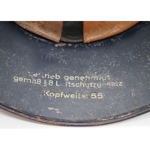 244 - WWII German Air Defence Gladiator helmet RL38/28 model, 3 part construction, complete with liner and... 