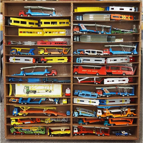 60 - Shelf unit displaying assorted model vehicles to include Dinky and Corgi