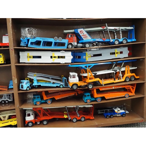 60 - Shelf unit displaying assorted model vehicles to include Dinky and Corgi