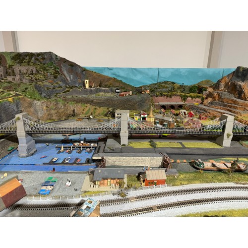 63A - OO Gauge scale model railway layout with detailed scenery including bridges, castles, stations, vehi... 