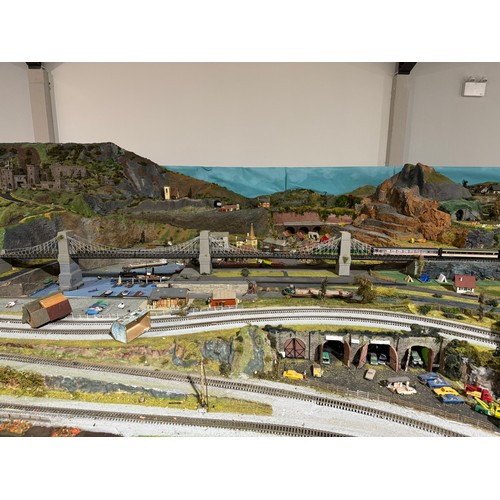 63A - OO Gauge scale model railway layout with detailed scenery including bridges, castles, stations, vehi... 