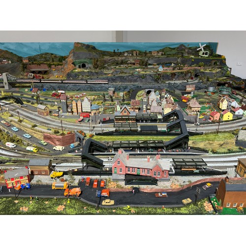 63A - OO Gauge scale model railway layout with detailed scenery including bridges, castles, stations, vehi... 