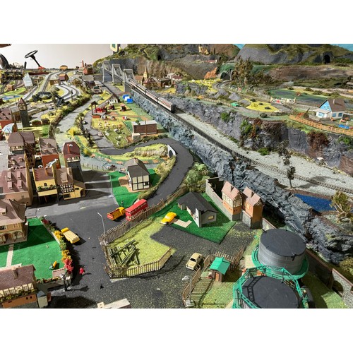 63A - OO Gauge scale model railway layout with detailed scenery including bridges, castles, stations, vehi... 