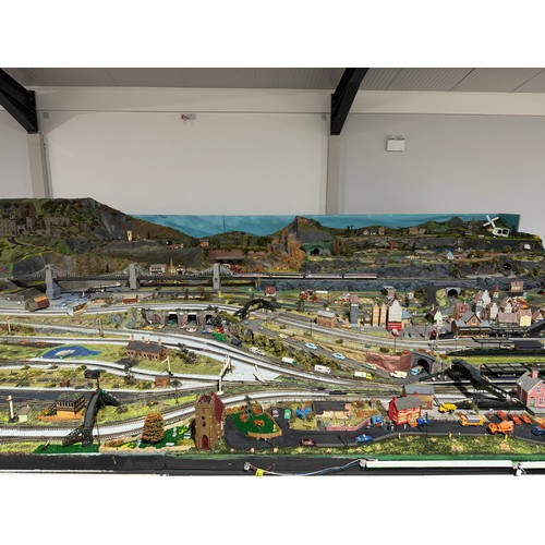 63A - OO Gauge scale model railway layout with detailed scenery including bridges, castles, stations, vehi... 