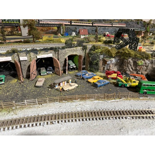 63A - OO Gauge scale model railway layout with detailed scenery including bridges, castles, stations, vehi... 