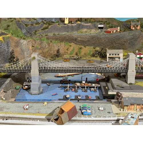 63A - OO Gauge scale model railway layout with detailed scenery including bridges, castles, stations, vehi... 