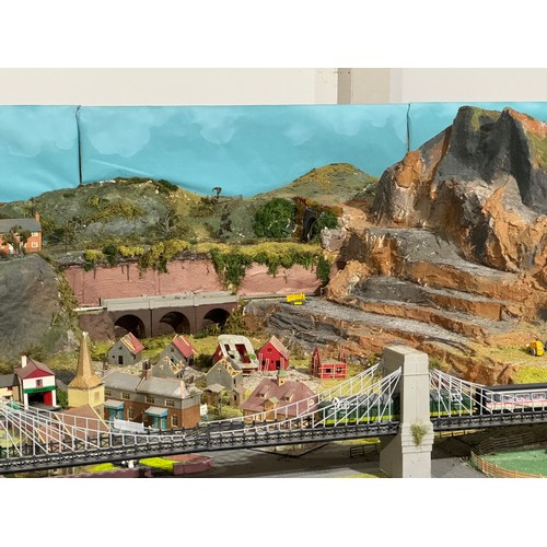 63A - OO Gauge scale model railway layout with detailed scenery including bridges, castles, stations, vehi... 