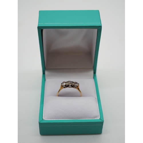 335B - 18ct Gold ring inset with 3 diamonds. 0.45 carats