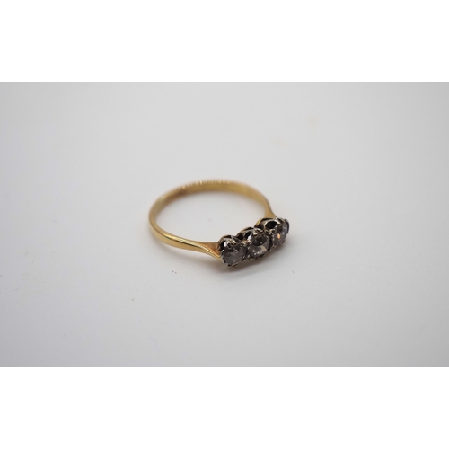 335B - 18ct Gold ring inset with 3 diamonds. 0.45 carats