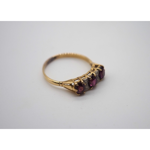 336A - Gold ring inset with rubies and diamonds