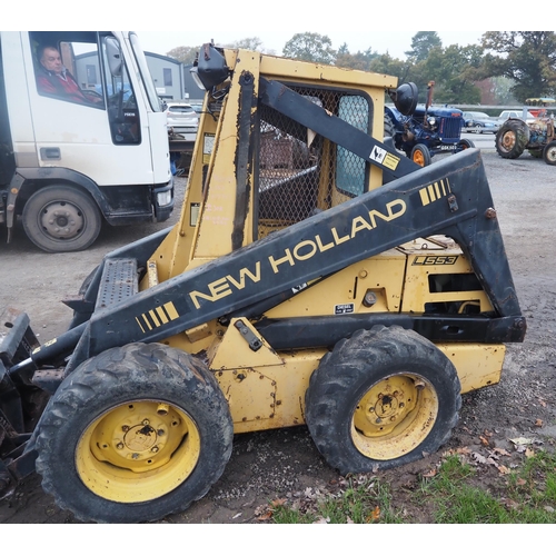 1592 - New Holland L553 skid steer loader and bucket