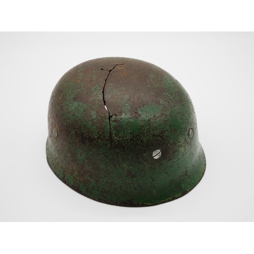 WWII German Fallschirmjager M38 helmet found in Normandy with Normandy camouflage on