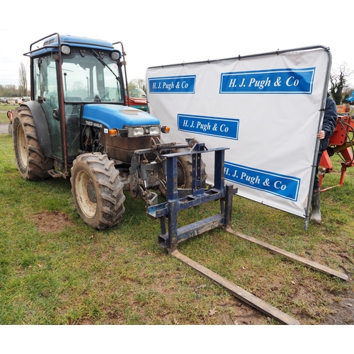 1602 - New Holland TN90F 4wd tractor. Runs and drives, off farm. Showing 6206 hours. C/w front linkage and ... 