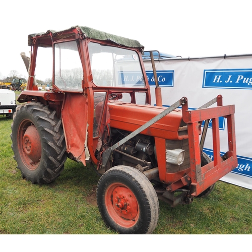 1603 - Massey Ferguson 135 tractor. Runs and drives, off farm. Showing 9870 hours. C/w front hydraulic lift... 