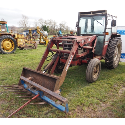 1648 - International 584 tractor. C/w Quicke 3260 loader, fork and bale spike. Showing 5677 hours. Reg. GMR... 