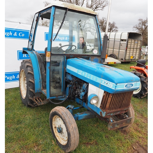 1731 - Ford 1710 compact tractor and cab frame. Runs and drives. Key in office