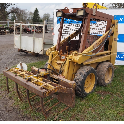 1732 - Case 1825 skid steer with muck fork. Key in office