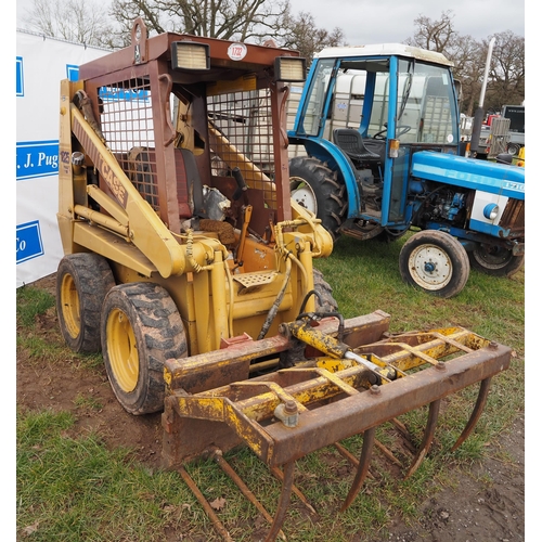 1732 - Case 1825 skid steer with muck fork. Key in office