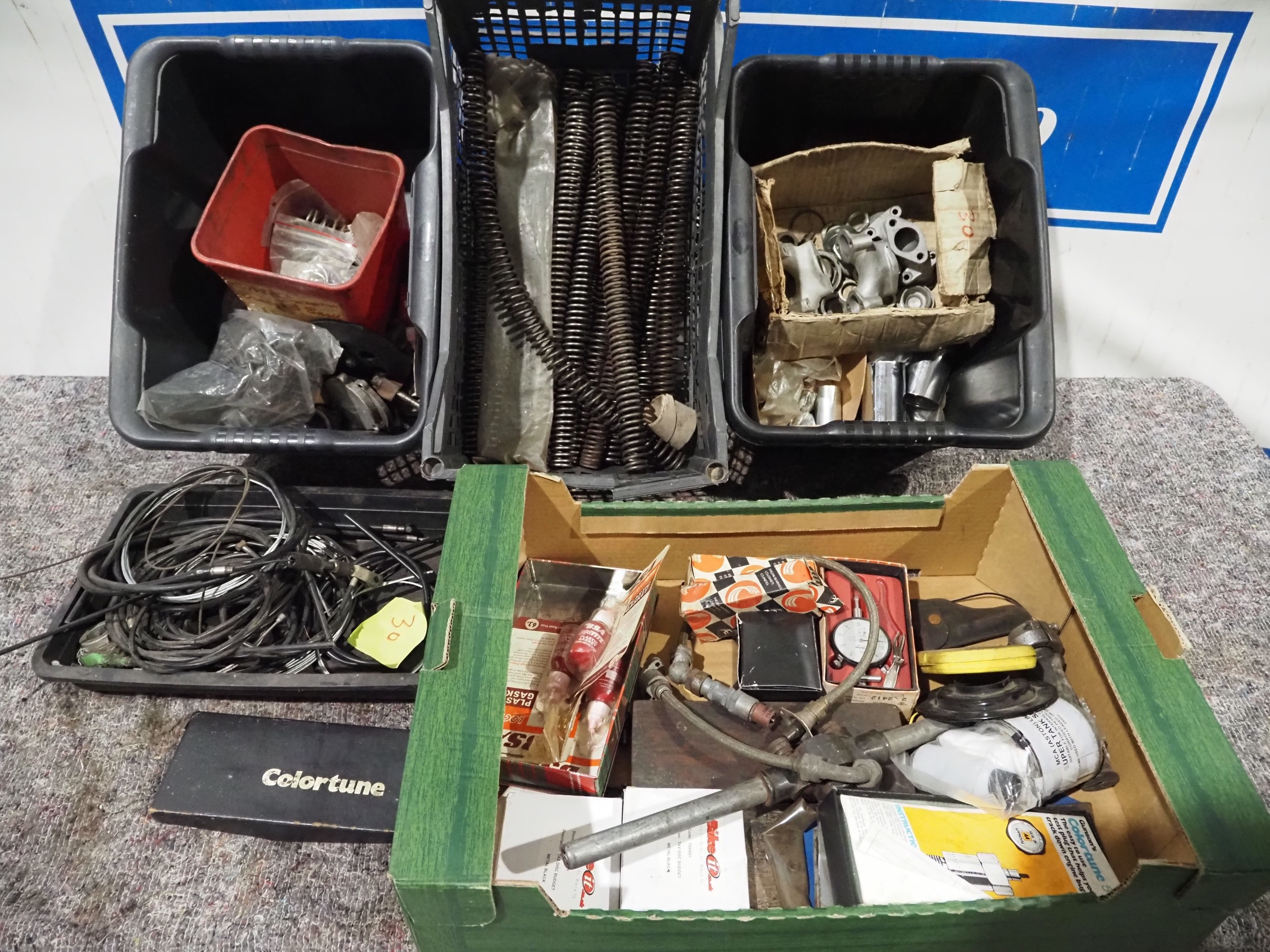 Assorted motorcycle spares and motorcycle tools