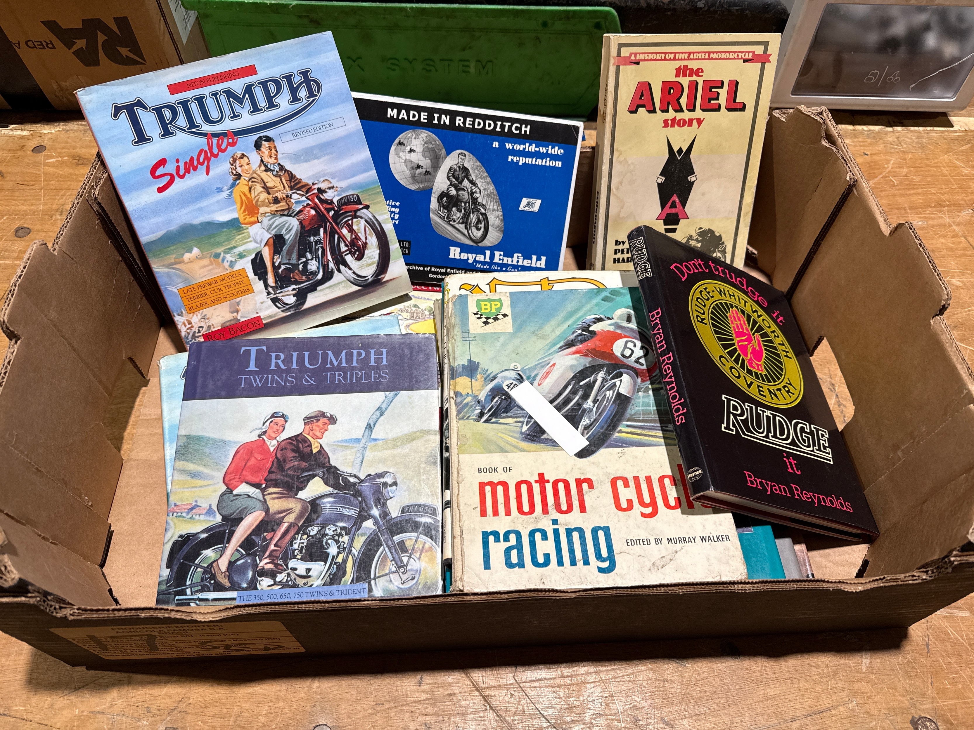 Box of illustrated motorcycle books