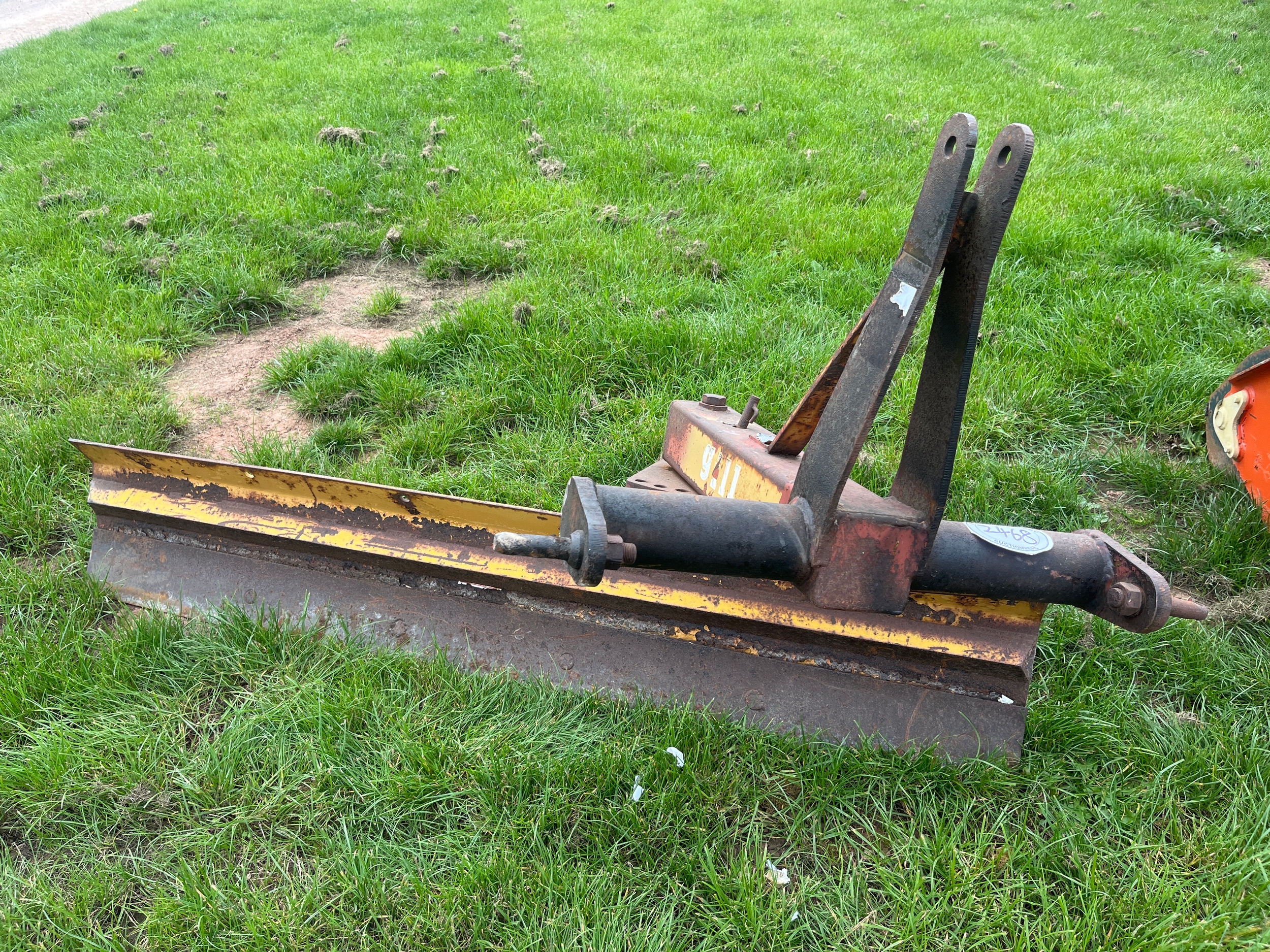 Rear mounted grader