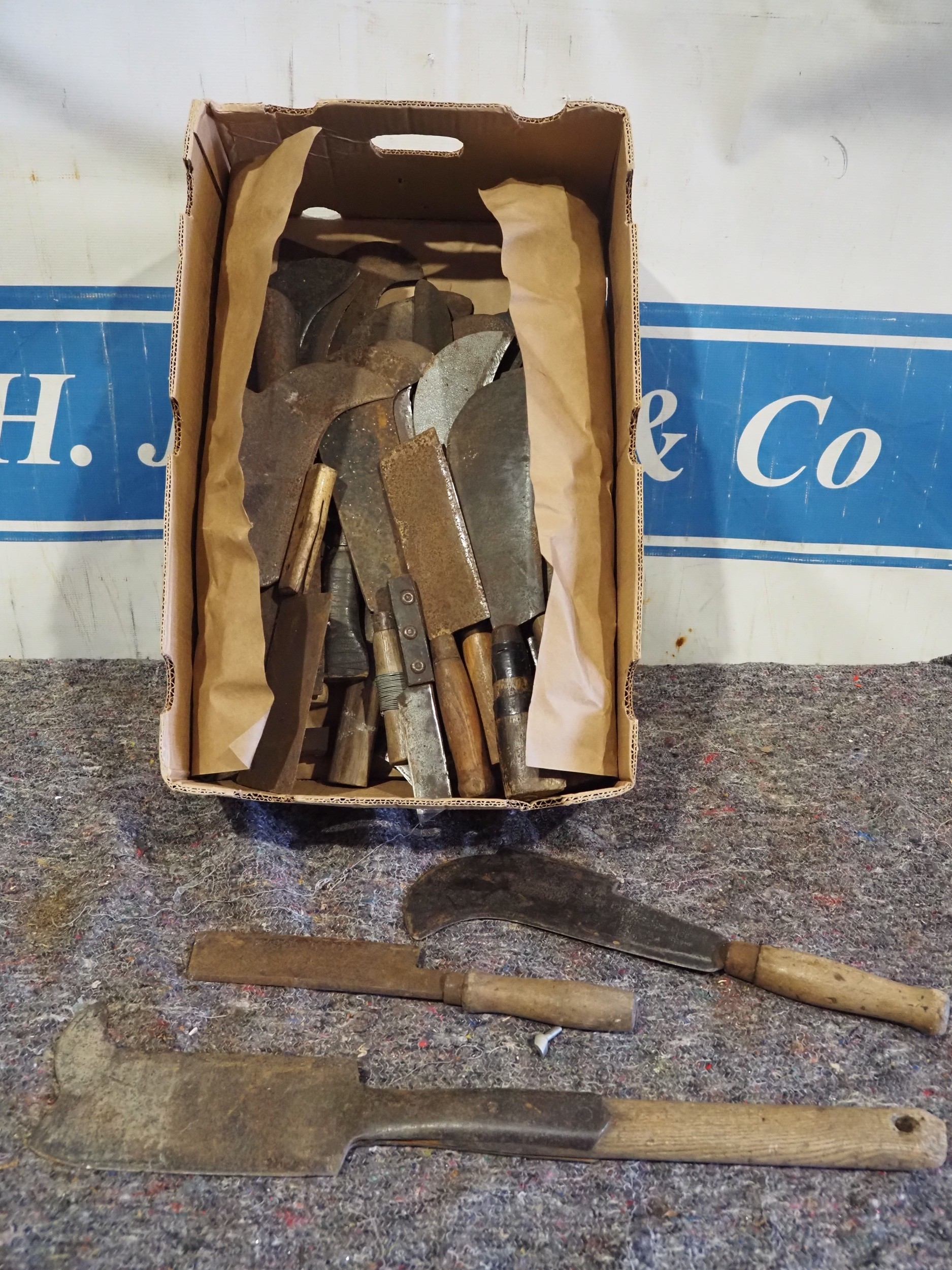 Large quantity of Bill hooks and cleavers