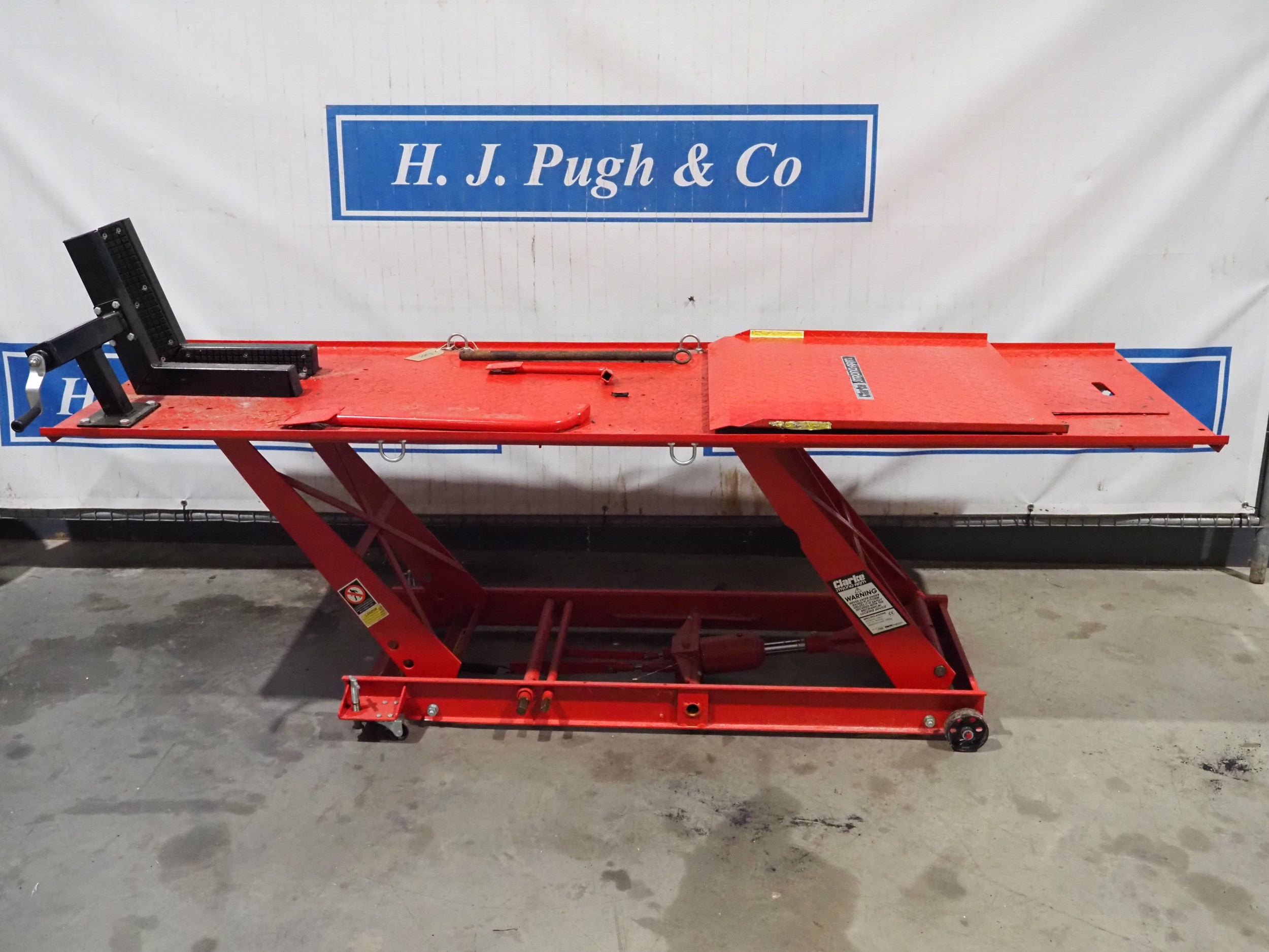 Clarke Strongarm motorcycle lift c/w ramp. 450kg. Property of a ...