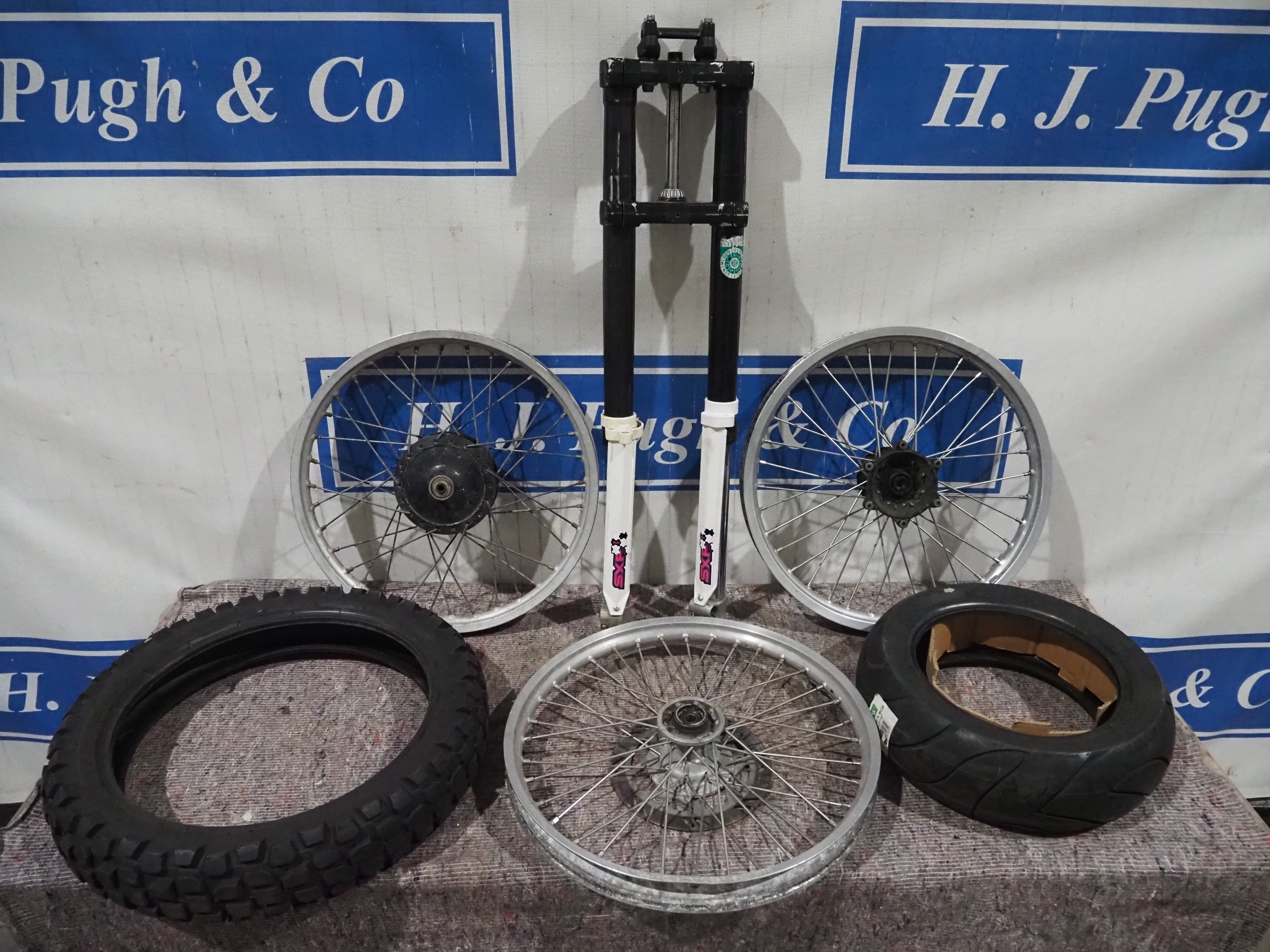 Various motorcycle wheels rims, tyres and forks
