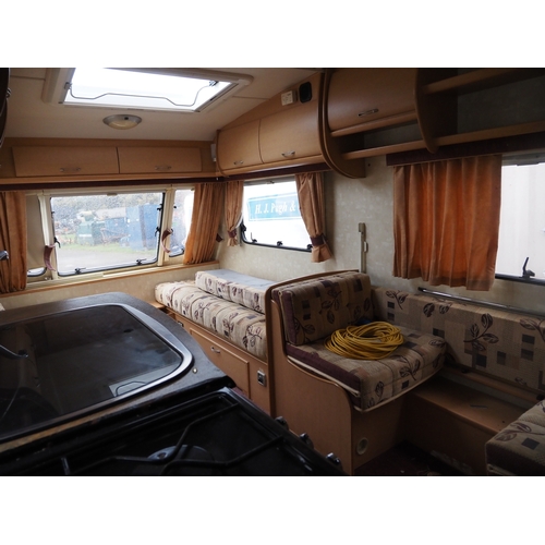 3013 - Abbey Freestyle 520E 4 berth caravan. 2005. Large lounge area that converts into a king size bed. Si... 
