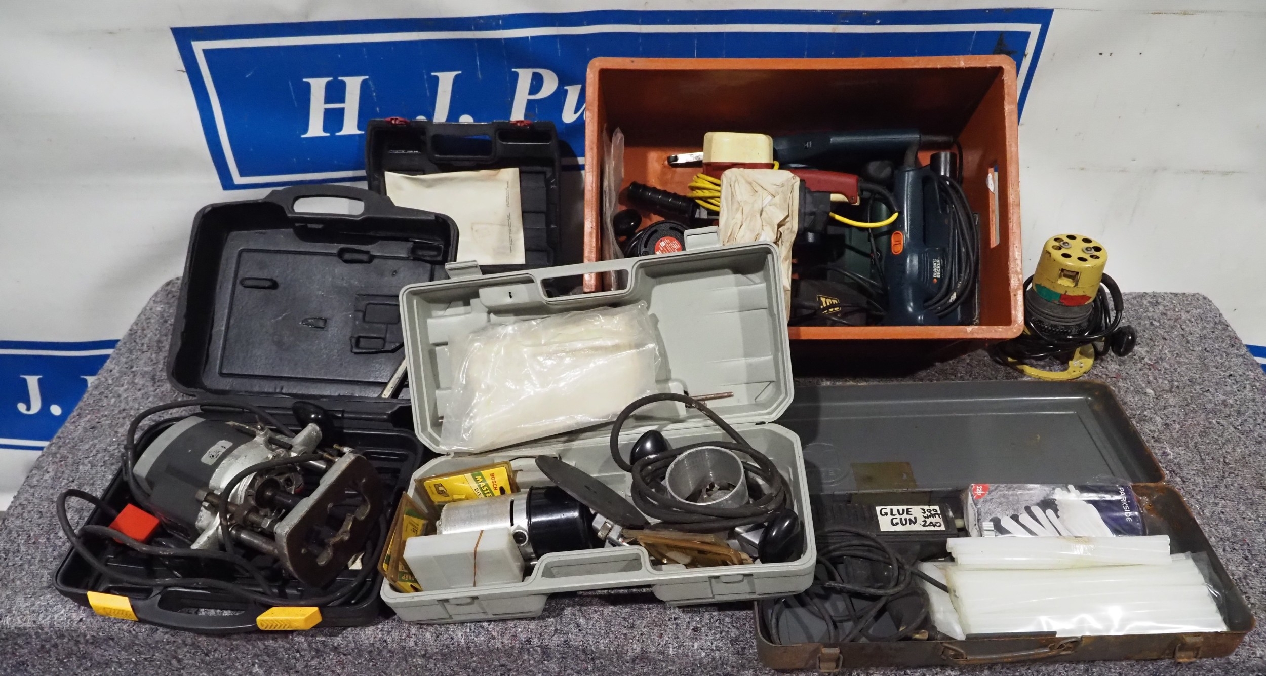 Various power tools to include routers, sanders, glue gun, etc.