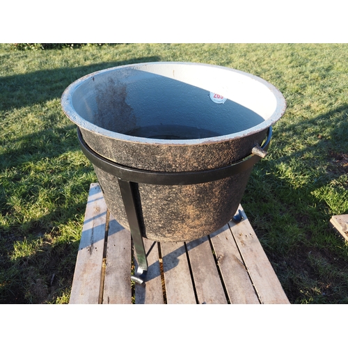 Cast iron cauldron in stand