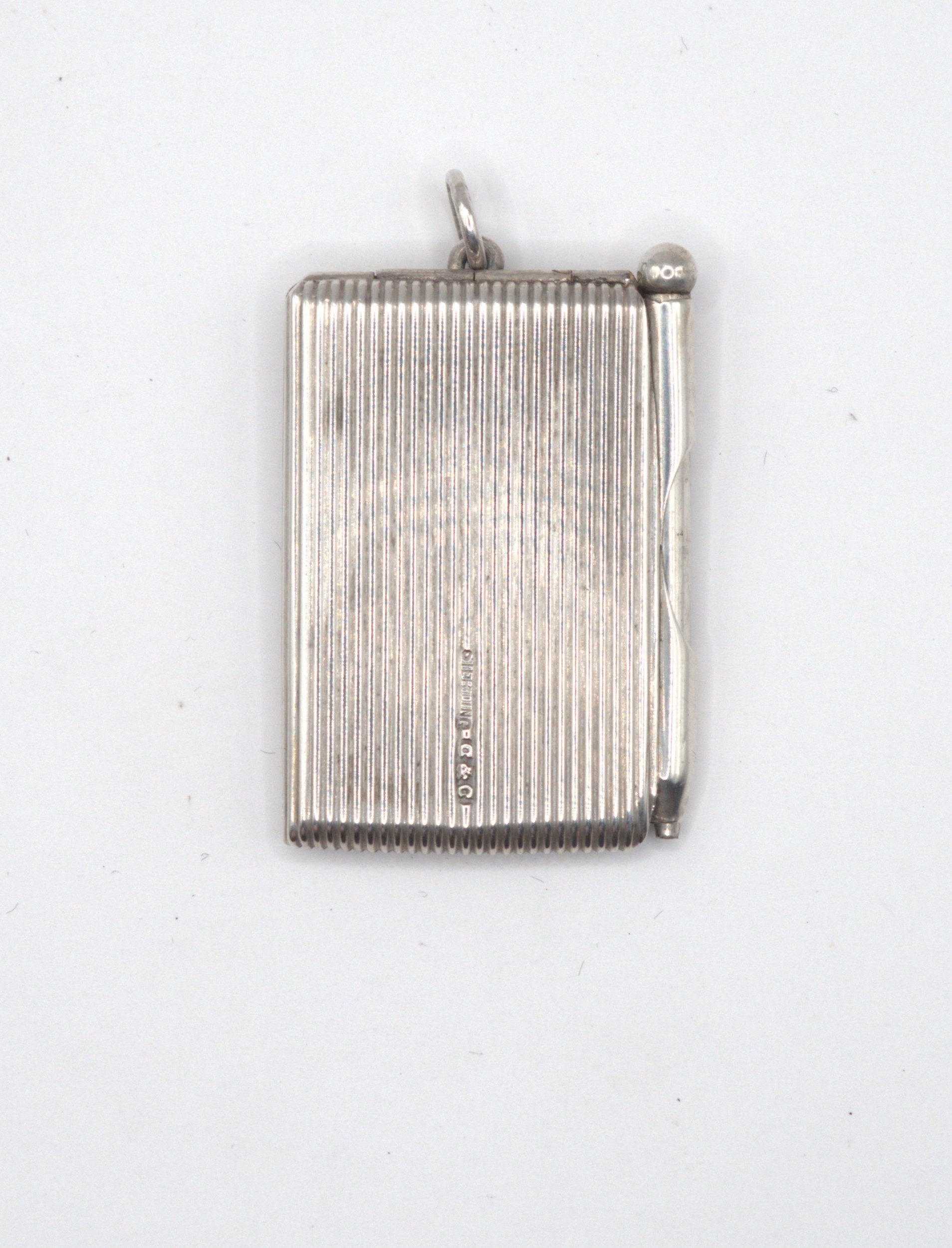 Silver notepad and pencil