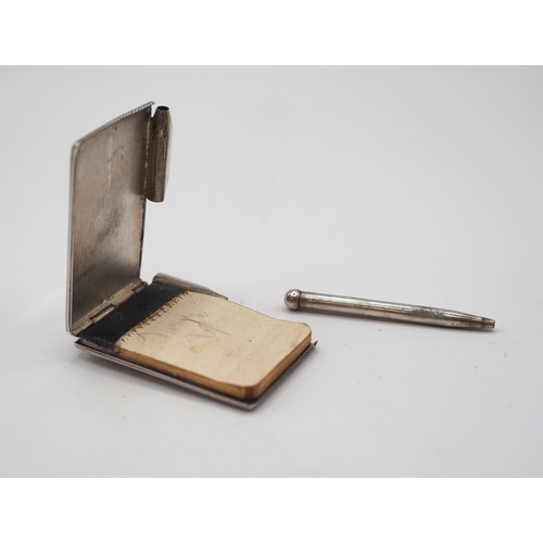Silver notepad and pencil