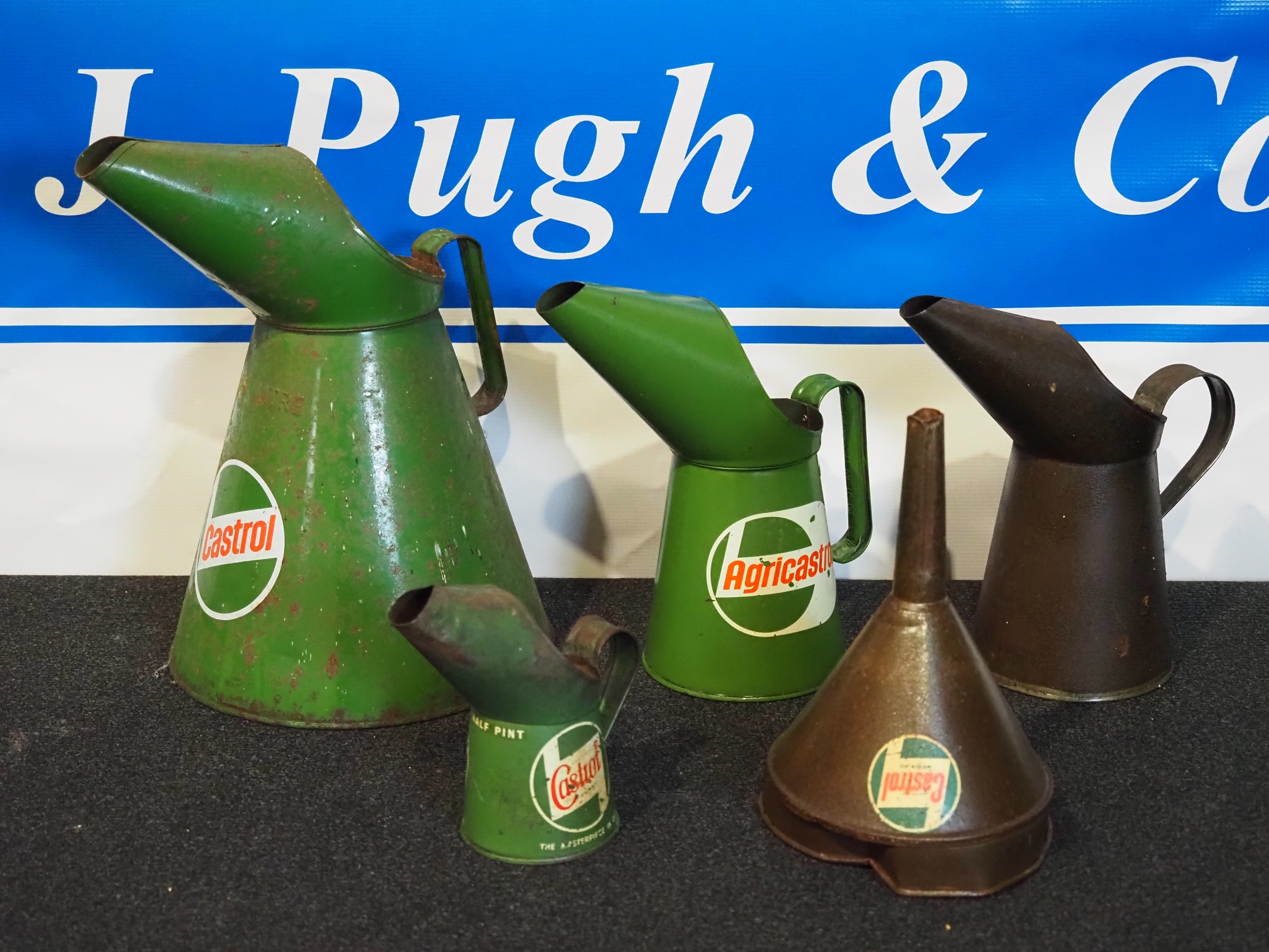 Assorted Castrol oil pourers and funnel